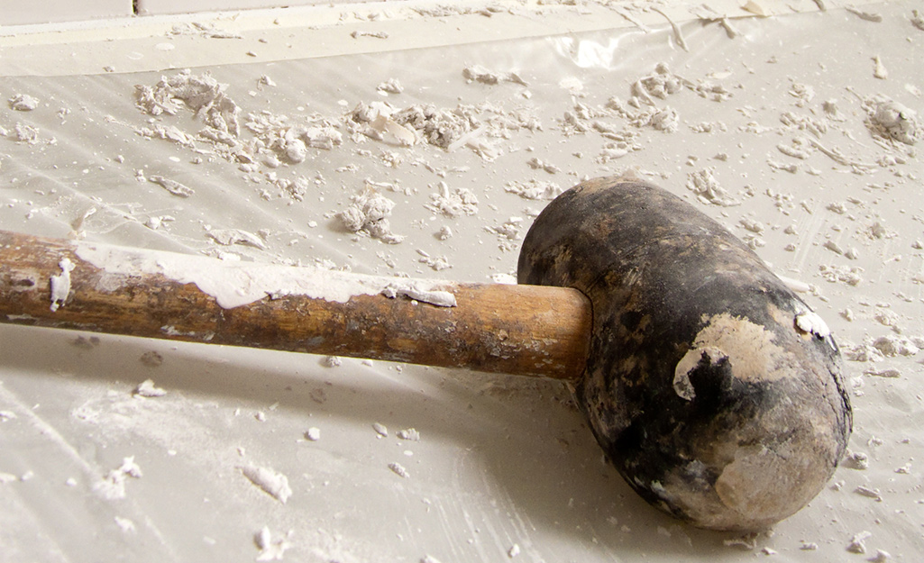 A close up of a worn sledgehammer.