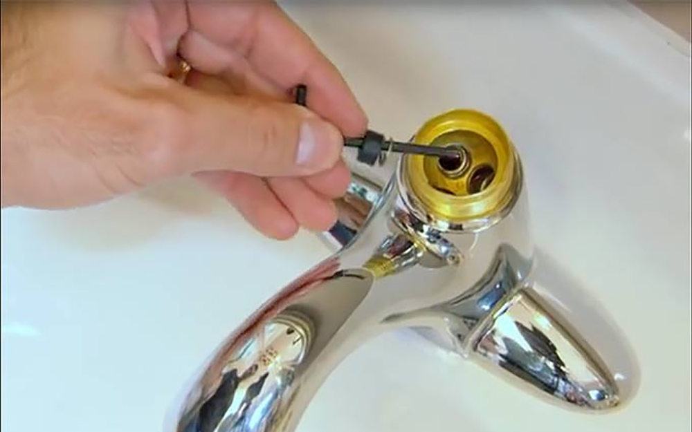 Seats and springs are removed from a ball faucet.
