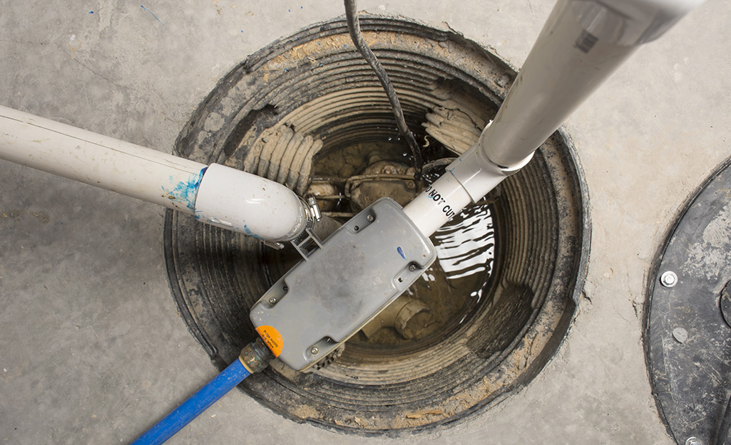 A submersible sump pump in a sump pit as viewed from above.