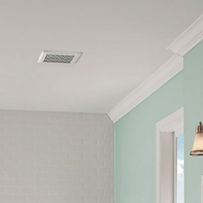 A bath fan installed in the ceiling of a bathroom.