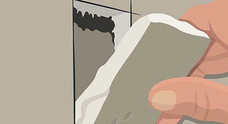 a person's hand pulling apart the cut wall a person's hand pulling apart the cut wall