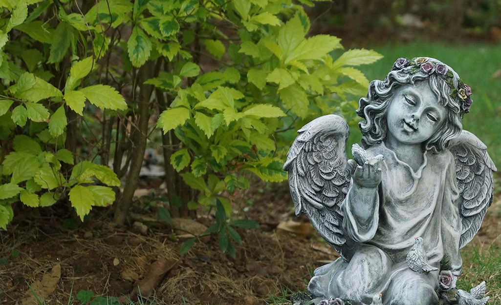 A statue of an angel girl with wings.