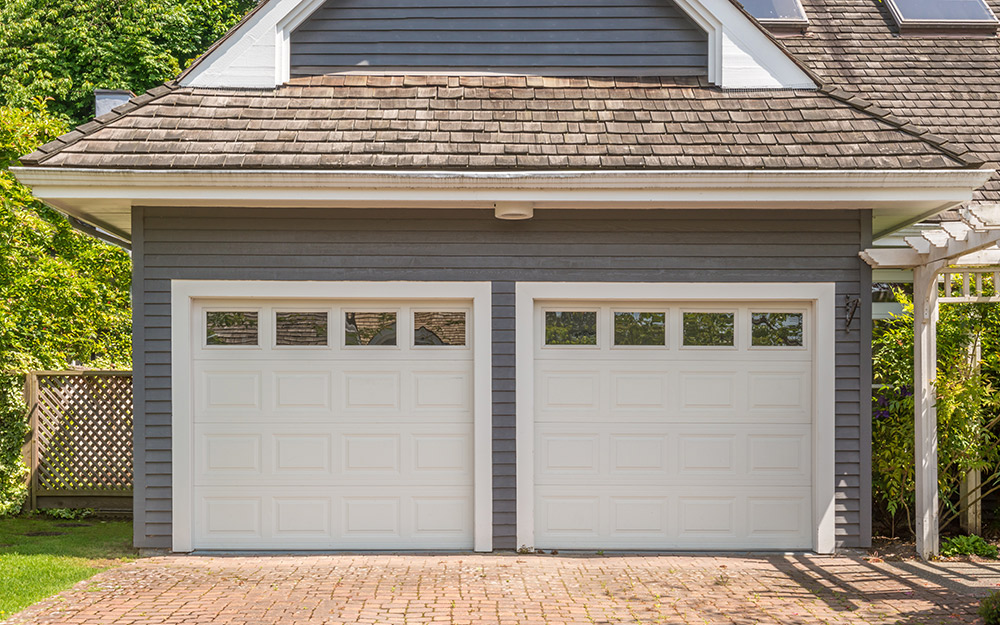 A pair of white garage doors are potential entry points for burglars.