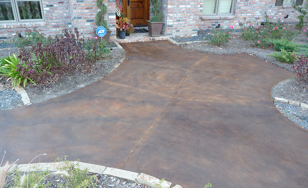 A concrete patio stained with brown stain.