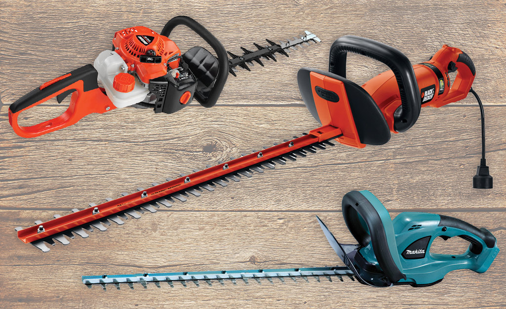 A variety of hedge trimmers on a table.