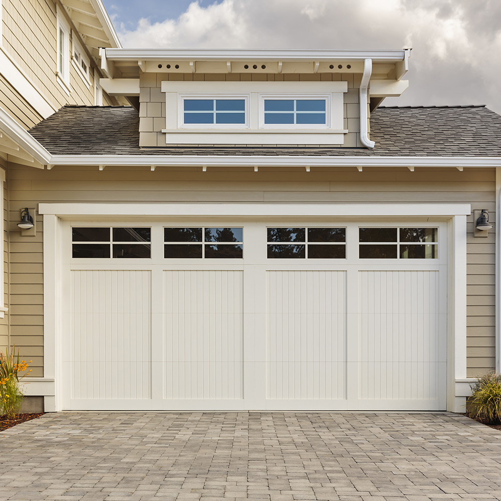 A home garage featuring a craftsman-style door.