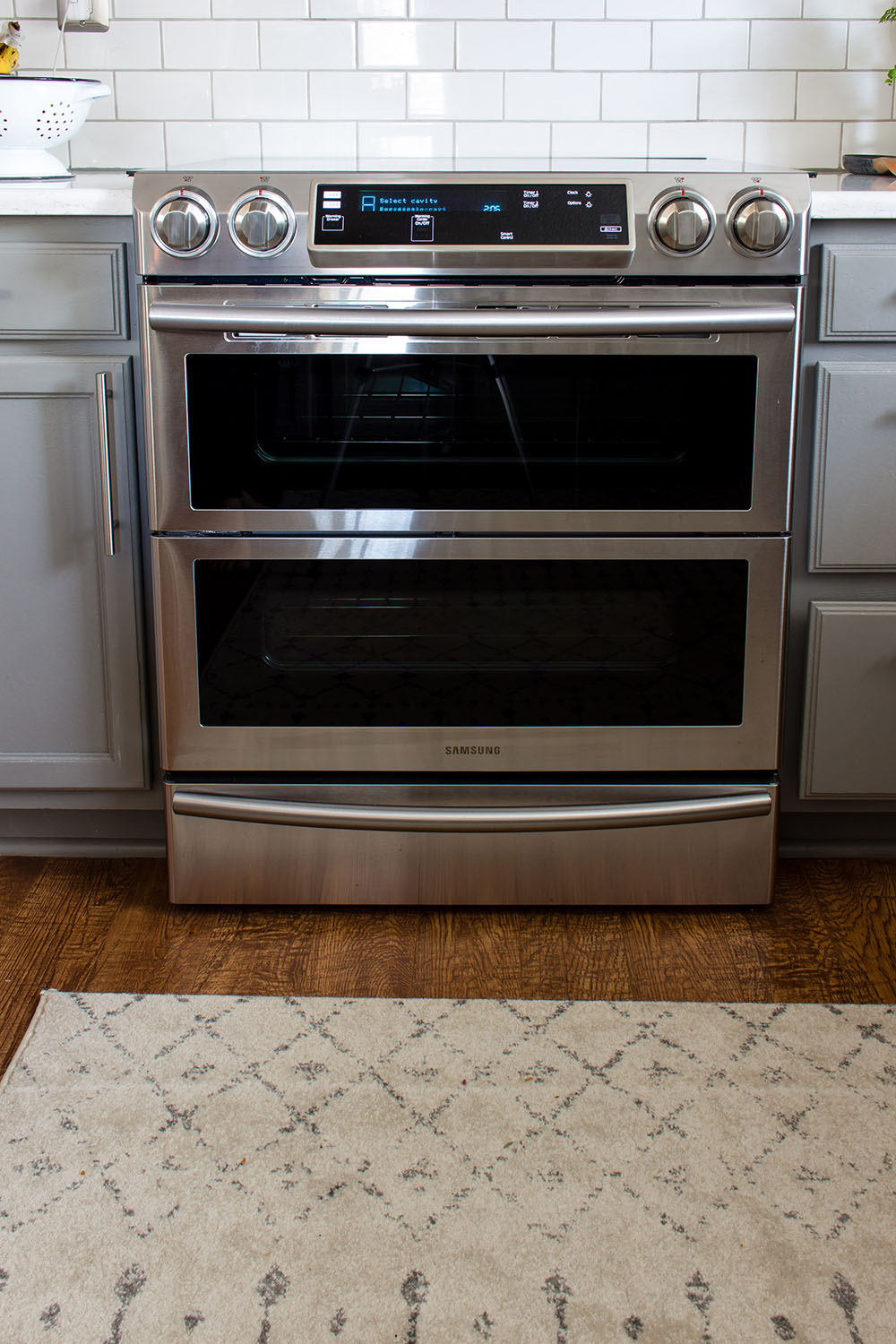 A Samsung double oven slide-in range in stainless steel.