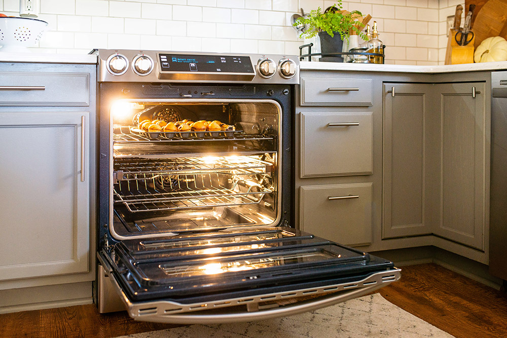 A dish sitting on the top rack inside a Samsung double oven.