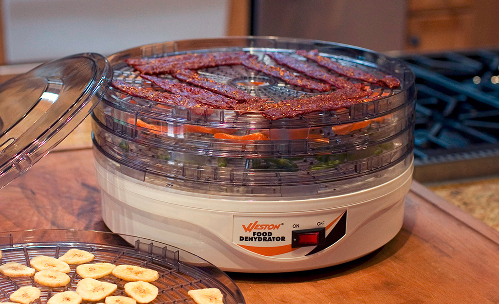 Meat inside a food dehydrator.