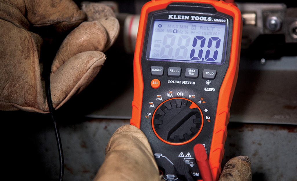 Someone using a multimeter to measure resistance. This resistor isn't generating power.