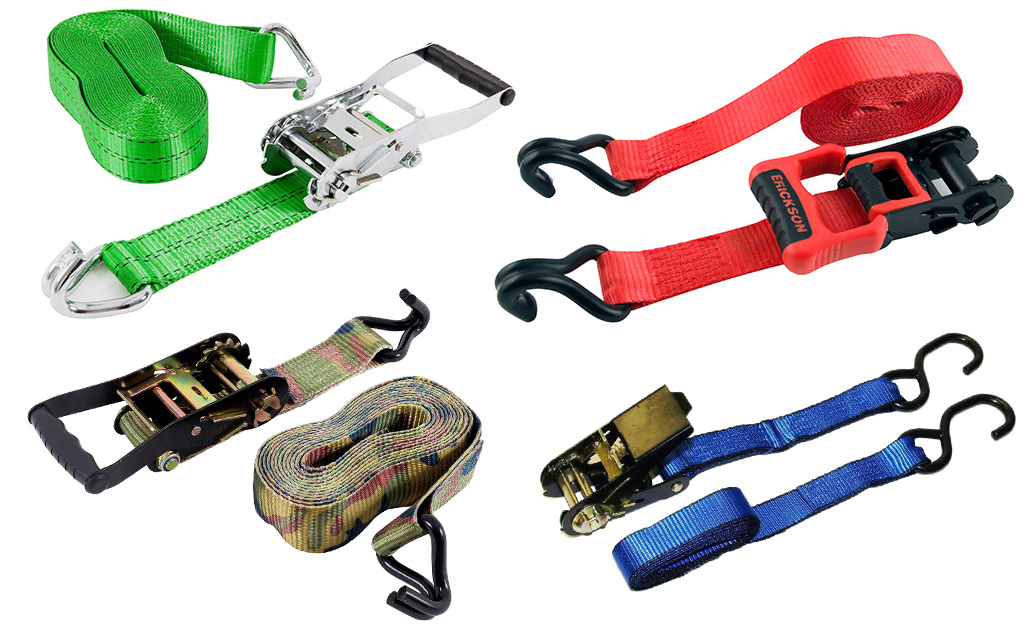 Different sizes and types of ratchet straps lay on a white background.
