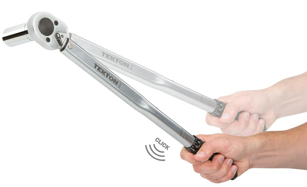 A person holding a torque wrench and demonstrating the movement