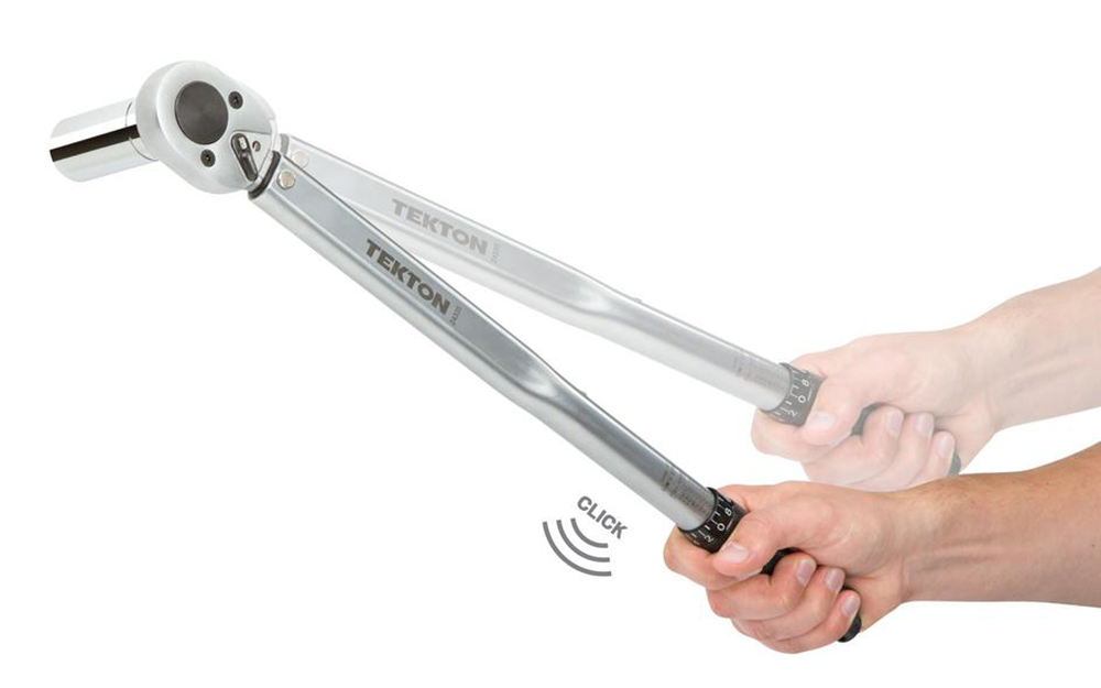 A person holding a torque wrench and demonstrating the movement