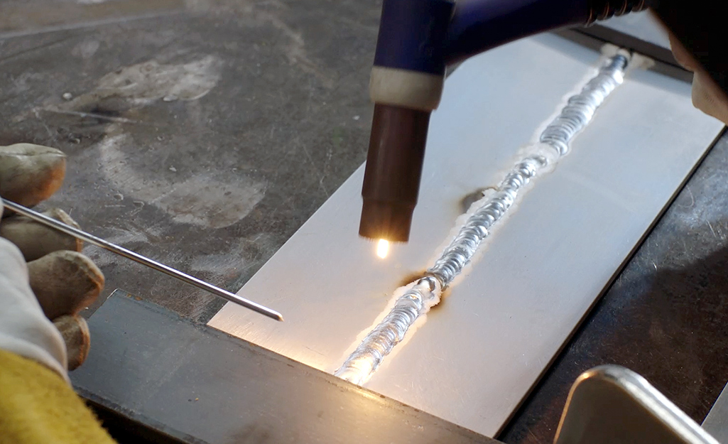 A piece of aluminum being welded. 