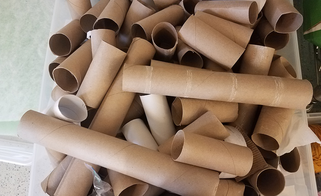 A container of paper tubes from empty rolls of toilet paper and paper towels.