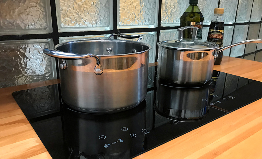 A built in induction cooktop on kitchen countertop