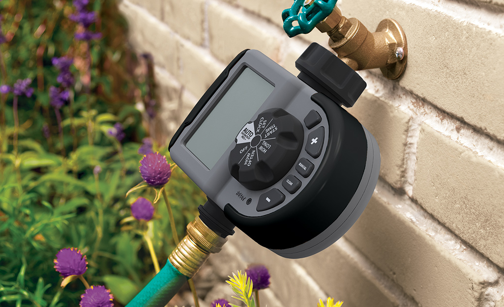 An irrigation timer attached to a hose. 