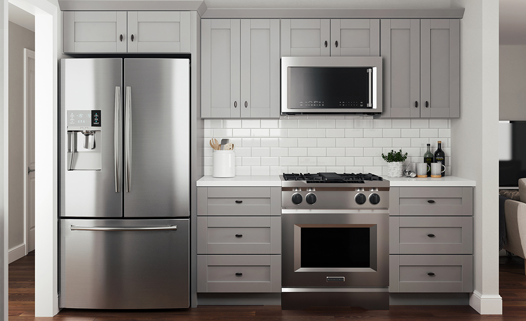 Kitchen cabinets of painted plywood.