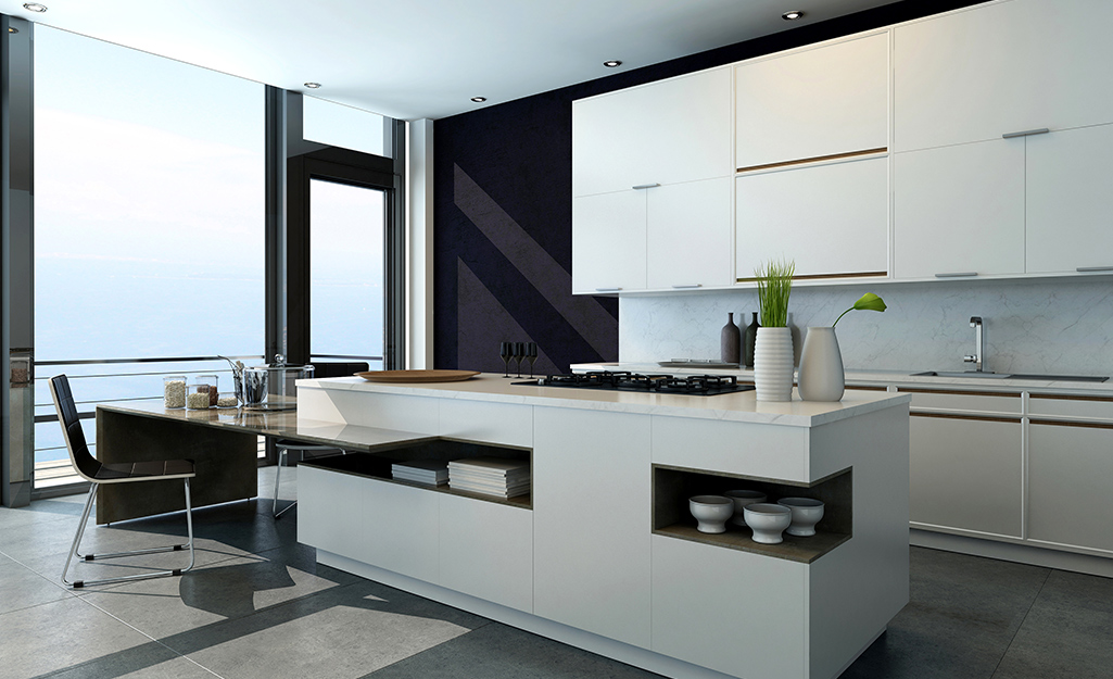 A kitchen featuring white cabinets and black accents.