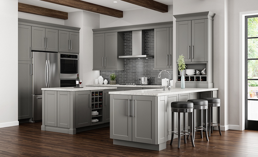 Two islands make up an open kitchen cabinet layout.