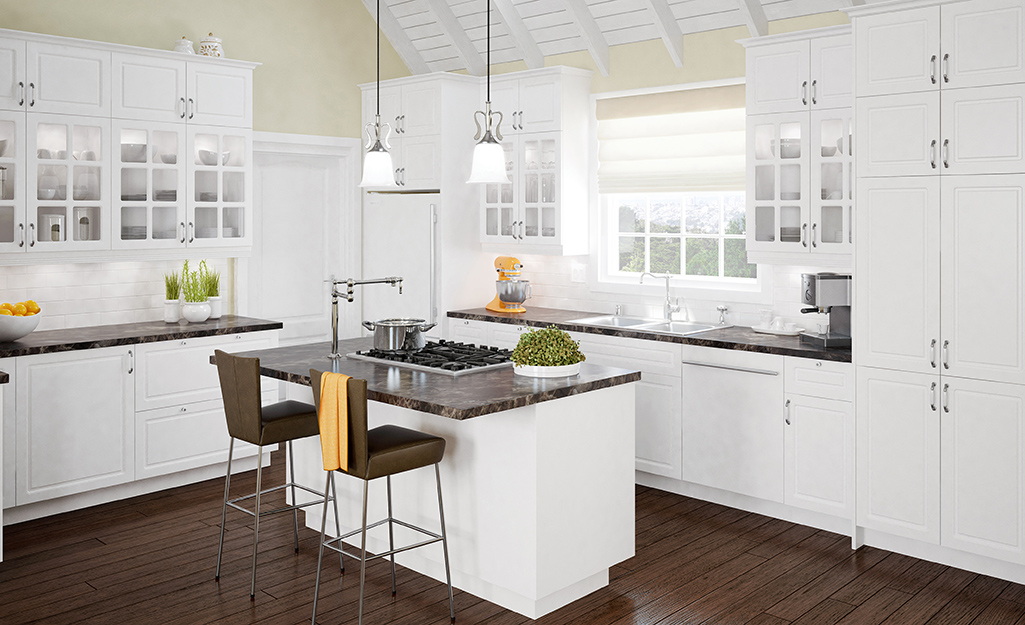 White kitchen cabinets in a corner-style layout.