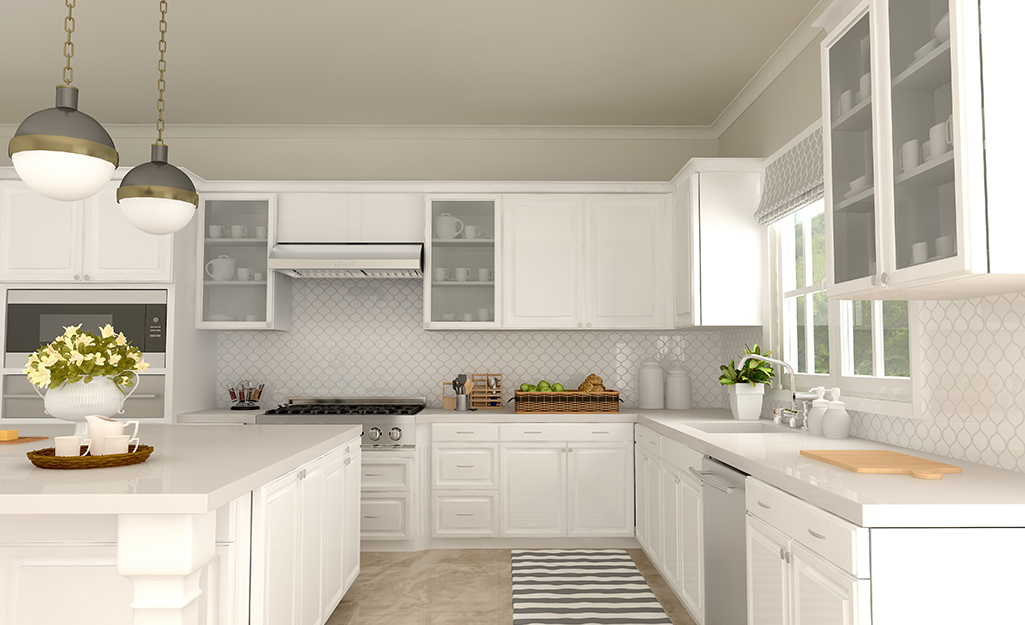 Glass-fronted cabinets in a white kitchen.