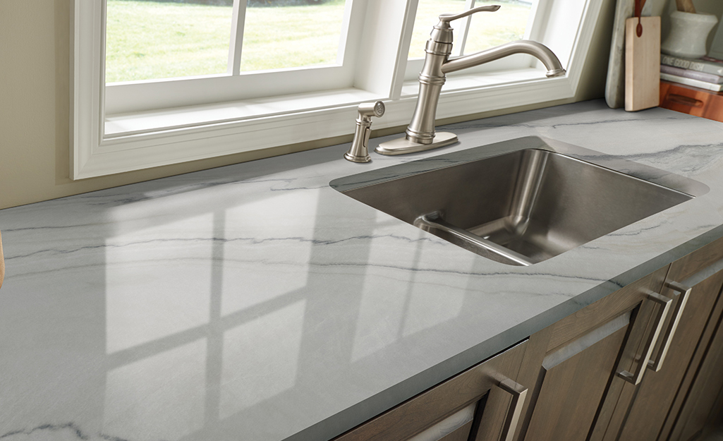 A kitchen with a light gray quartzite countertop.