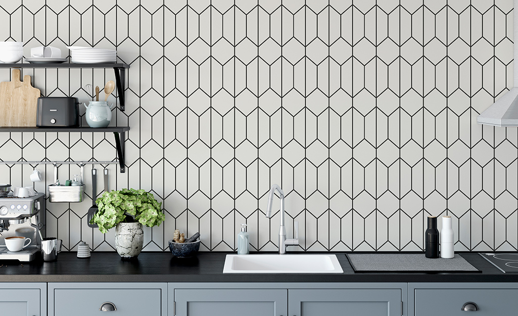 Geometric wallpaper hanging over a kitchen sink.