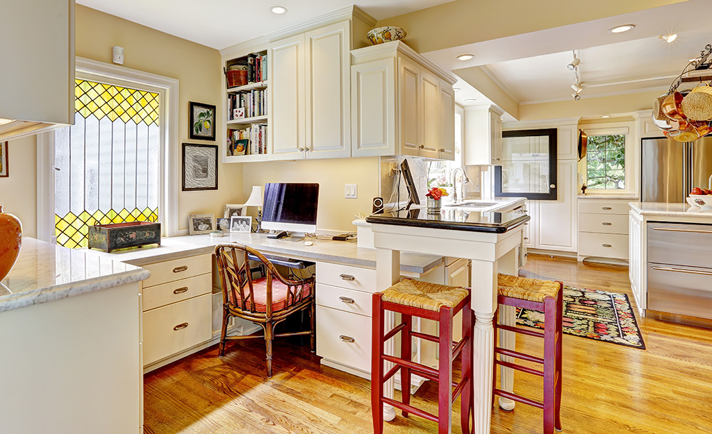 A small work station built into a kitchen space.