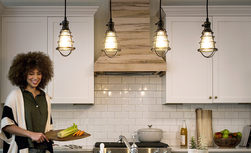Industrial-style pendant lighting installed in a kitchen.