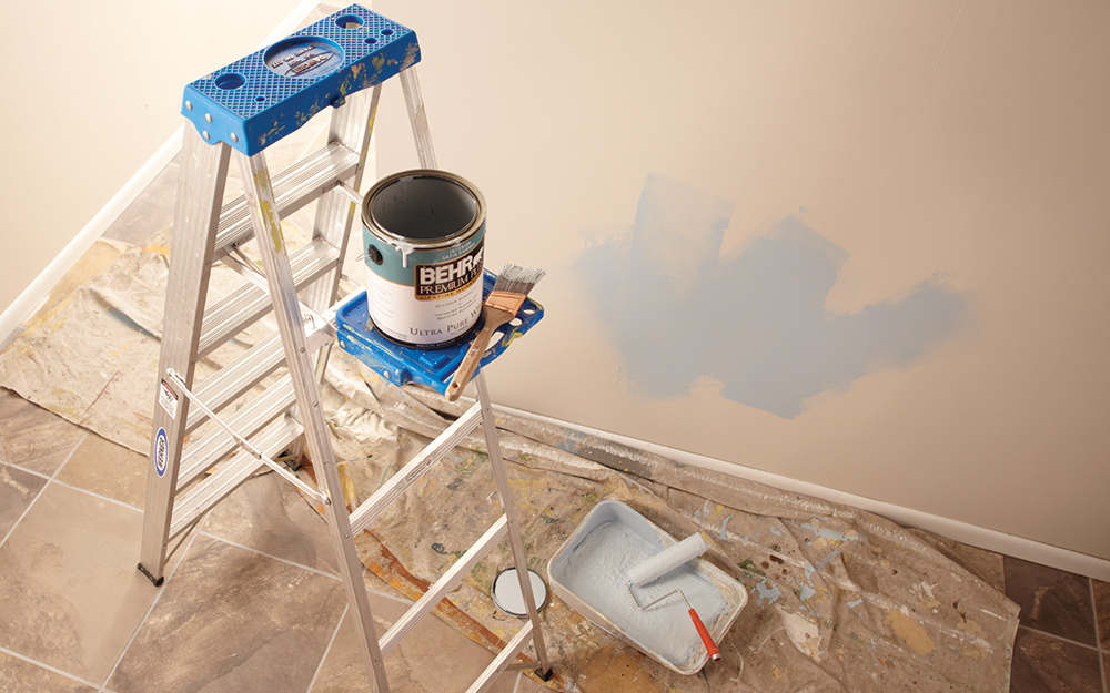 A ladder with a project tray attached A ladder with a project tray attached