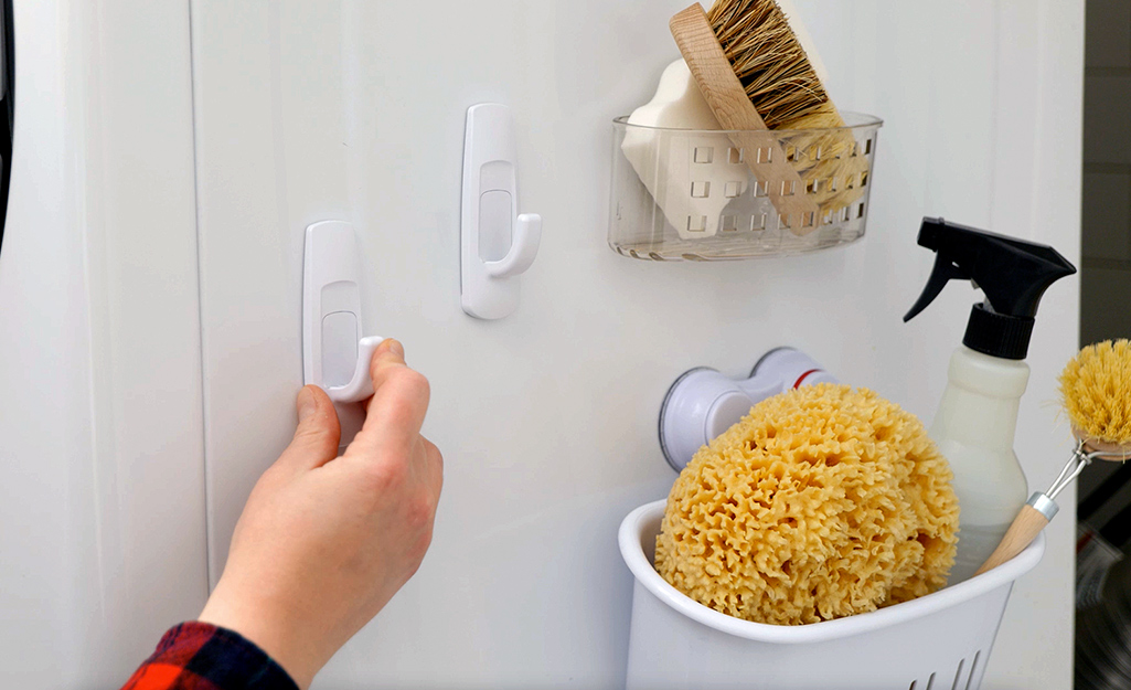 Hangers attached to the side of the washer or dryer to help with storage.