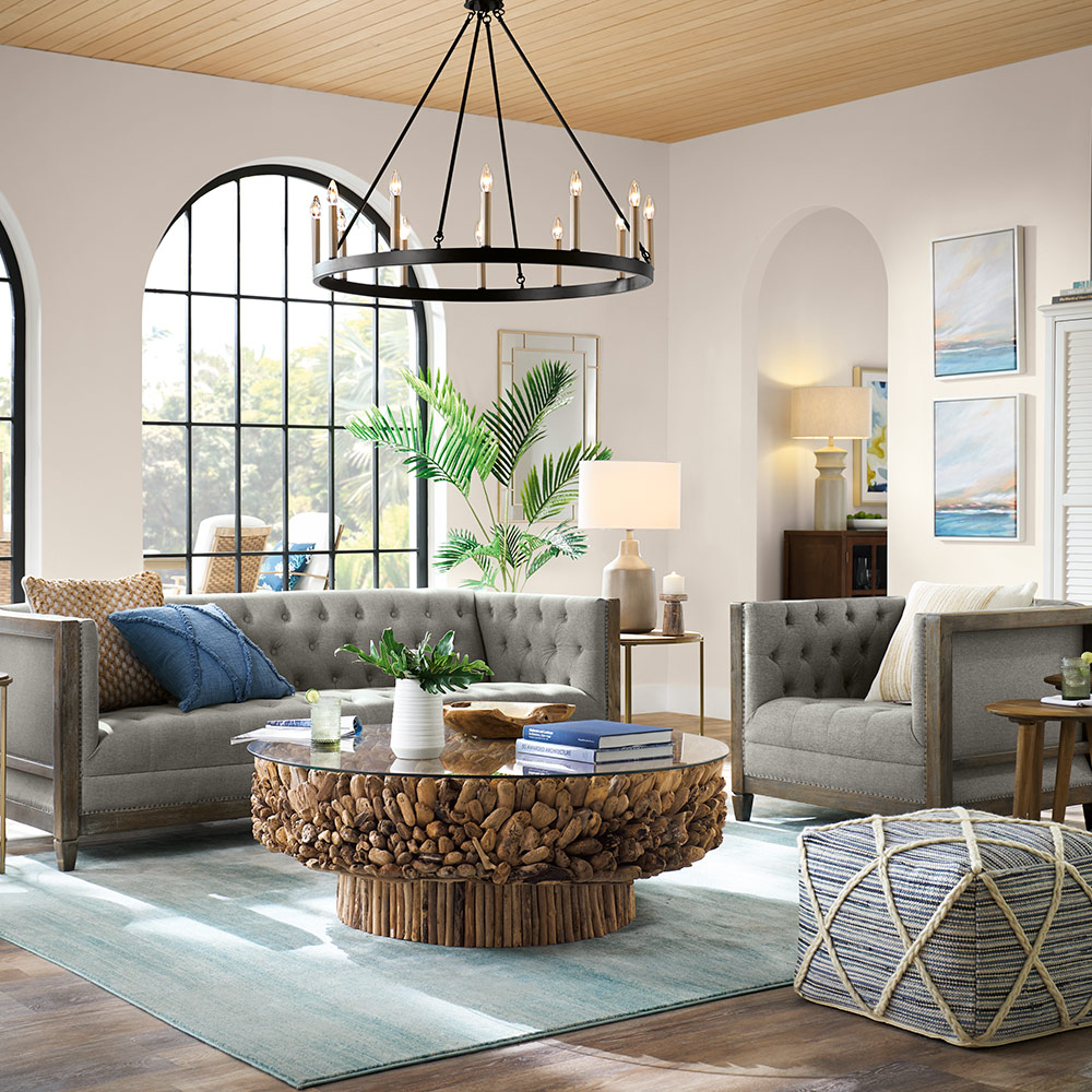A modern living room with a round coffee table.