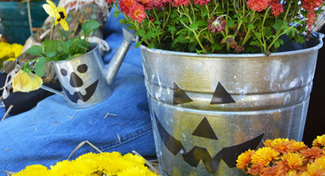Two buckets with jack-o-lantern faces.