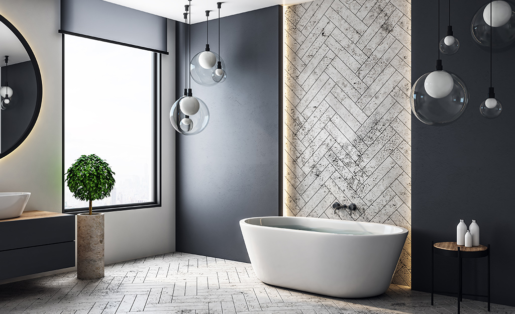 A primary bath featuring opulent pendant lighting. A primary bath featuring opulent pendant lighting.