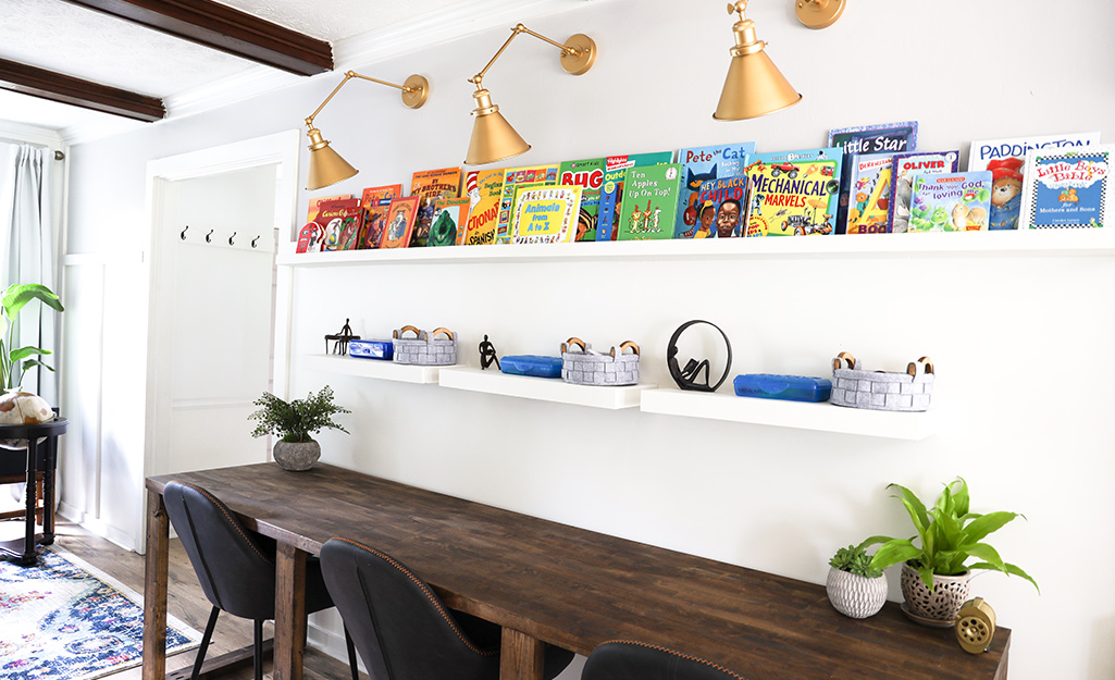 Floating storage shelves in a modern learn at home space.