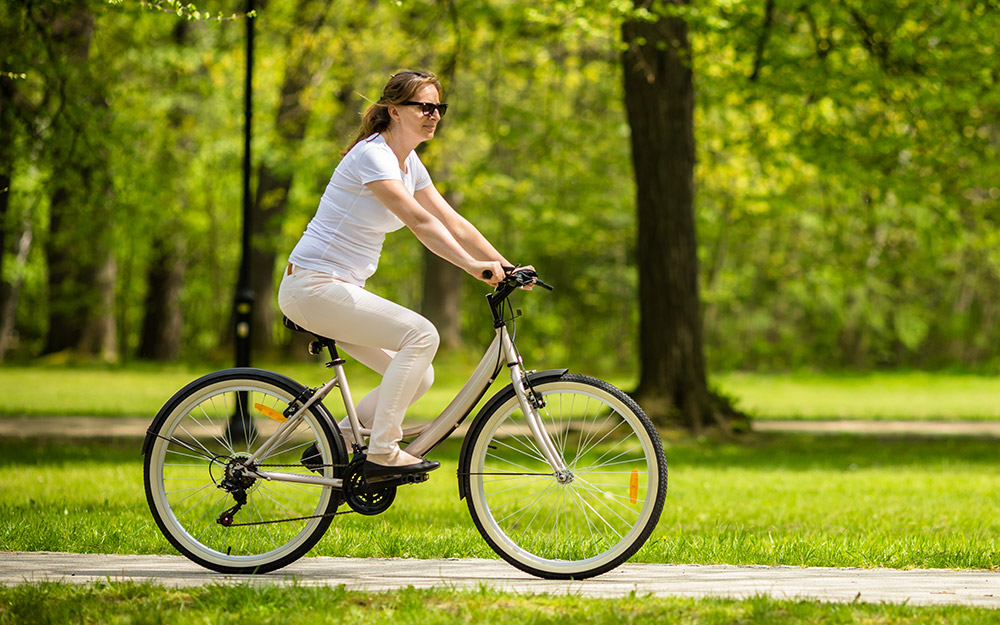 Woman riding a bike. Woman riding a bike.