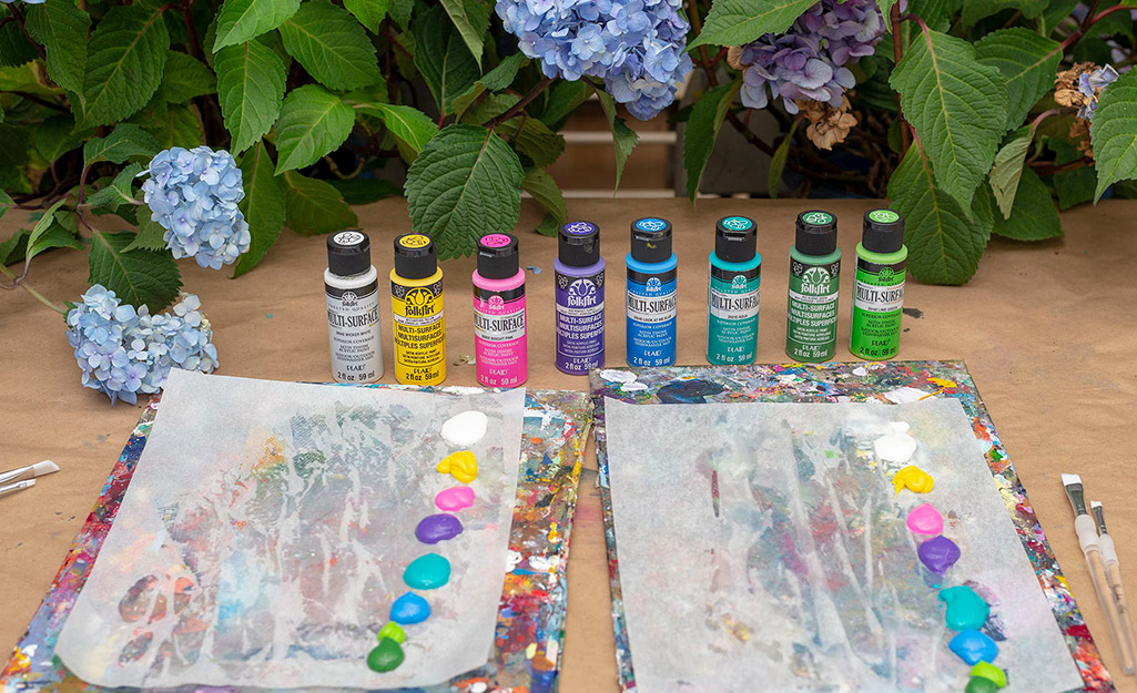 A collection of acrylic paint on a table.