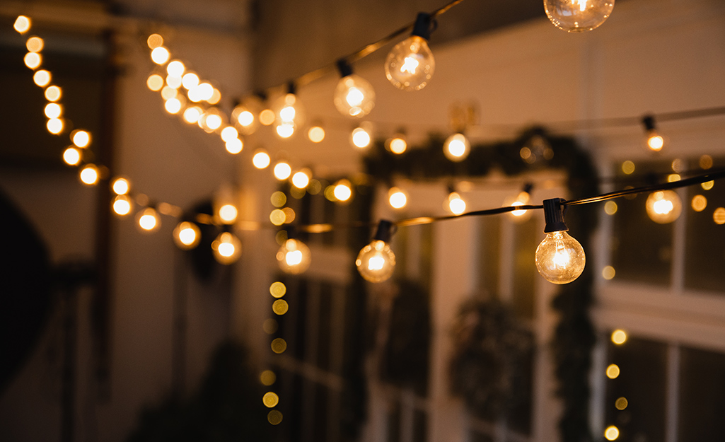 Outdoor string lights hang outside a home. 
