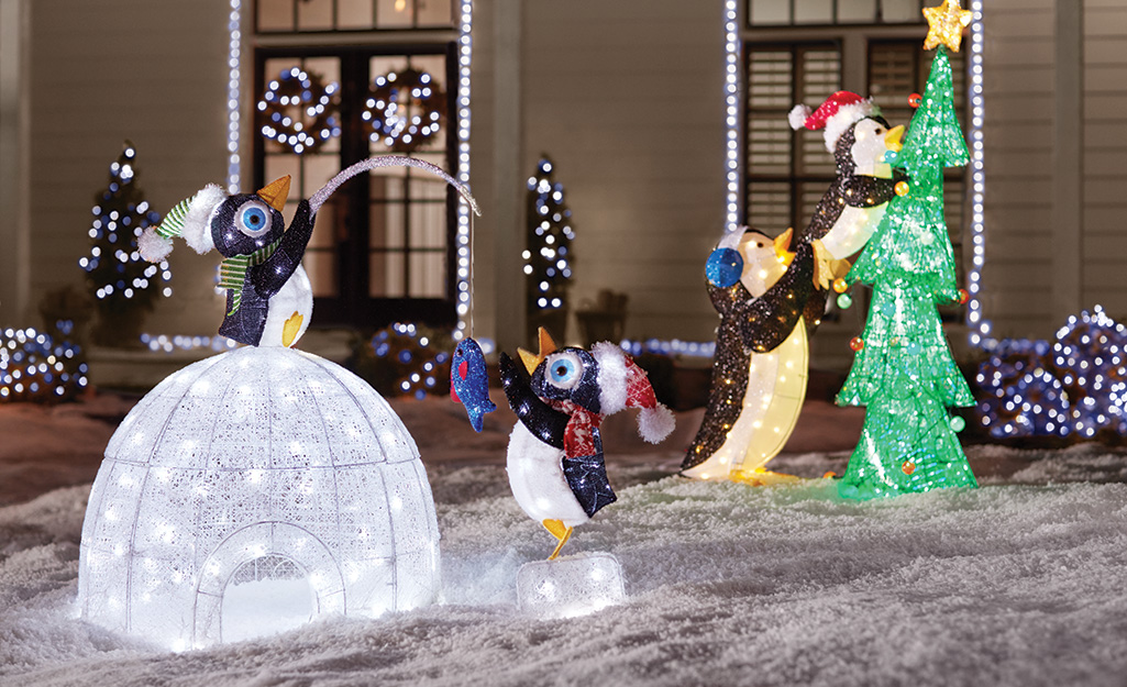 Whimsical animals building an igloo and decorating a Christmas tree. Whimsical animals building an igloo and decorating a Christmas tree.