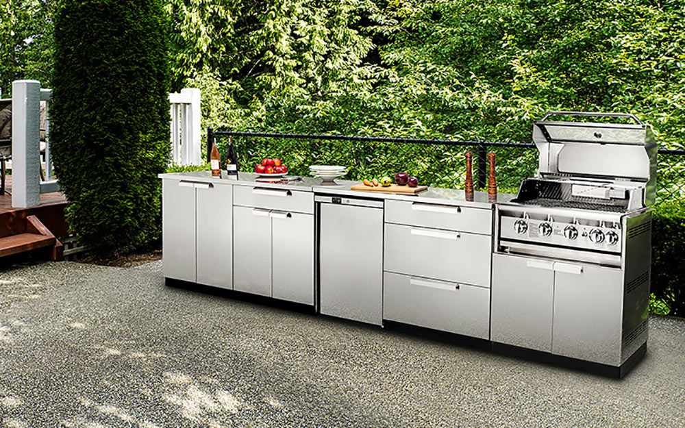 A stainless steel outdoor kitchen with built-in grill.