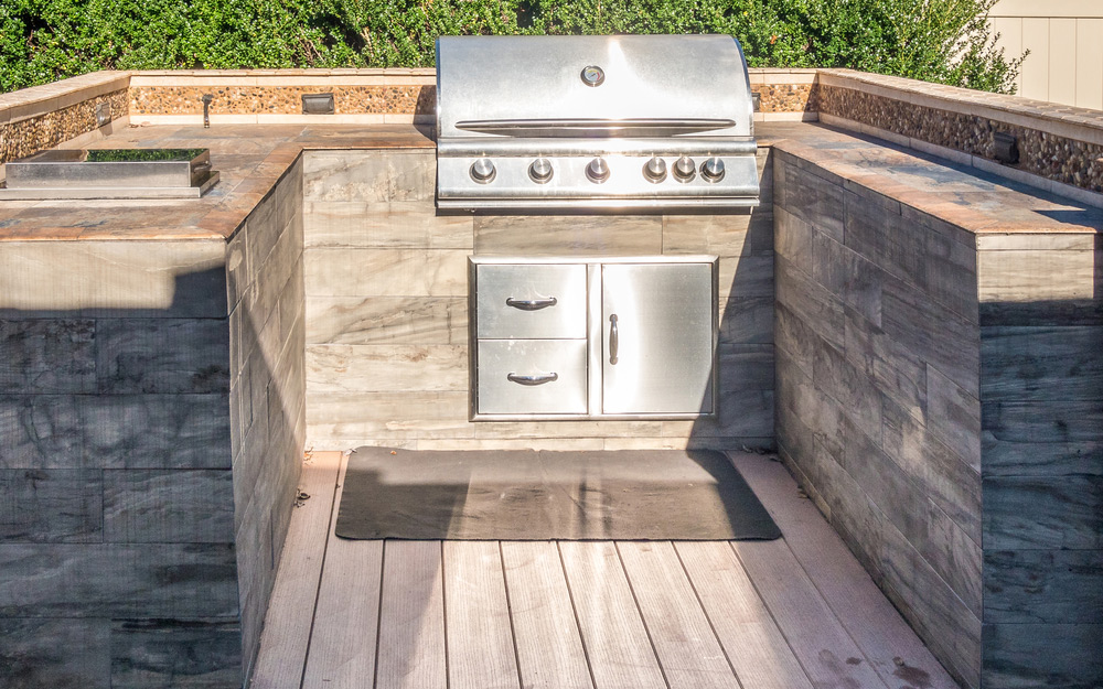 A u-shaped outdoor kitchen.