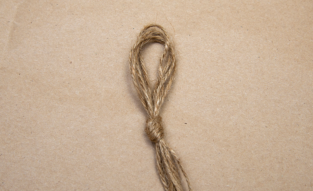 Lengths of twine tied together to form a loop.
