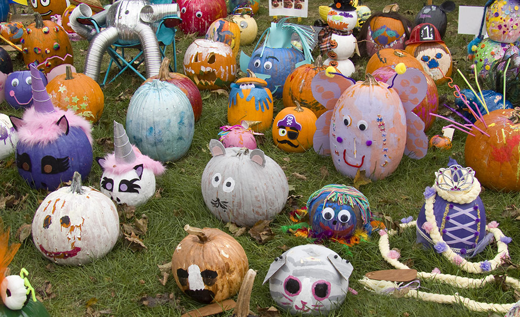 A group of painted and decorated pumpkins.