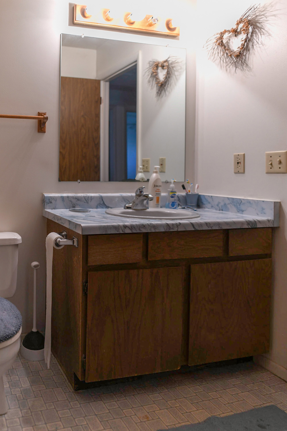 An outdated bathroom vanity. An outdated bathroom vanity.