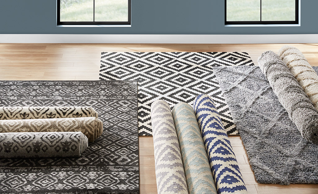 A sampling of standard area rugs on a floor.