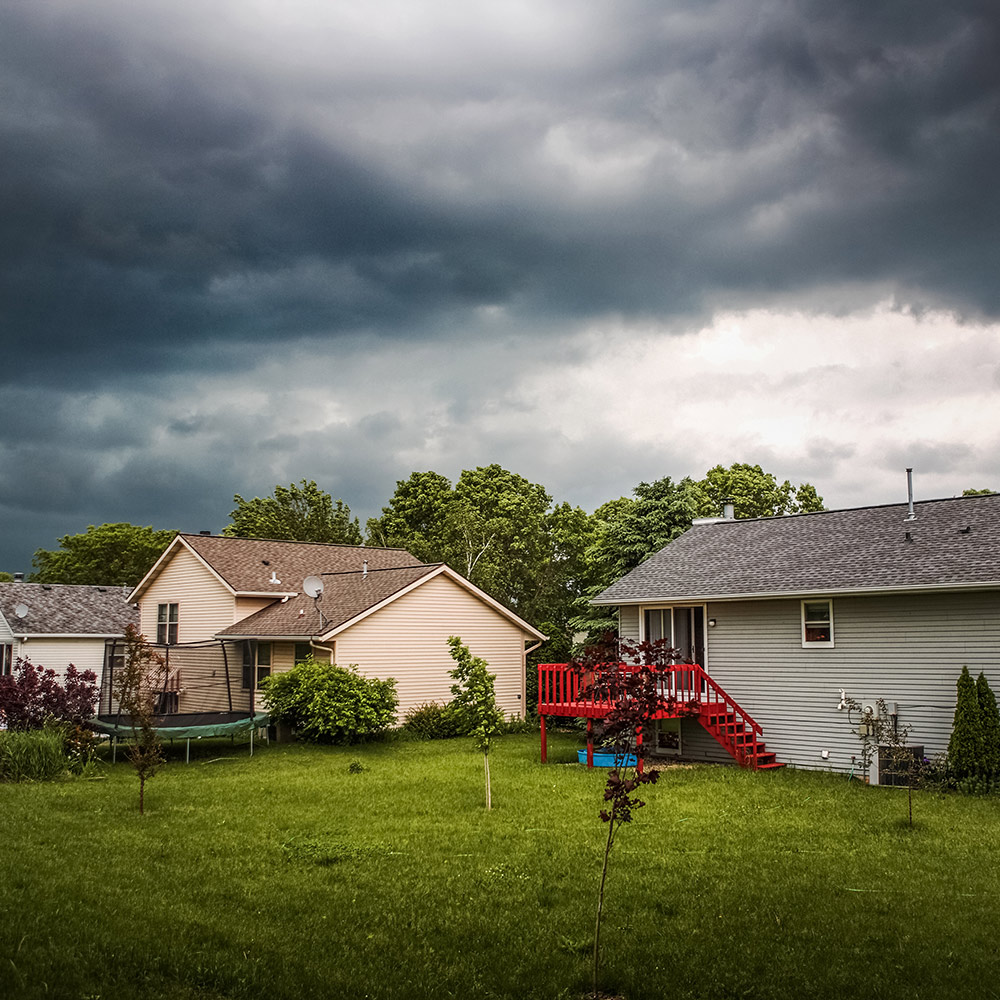 A thunderstorm moving across a neighborhood. A thunderstorm moving across a neighborhood.