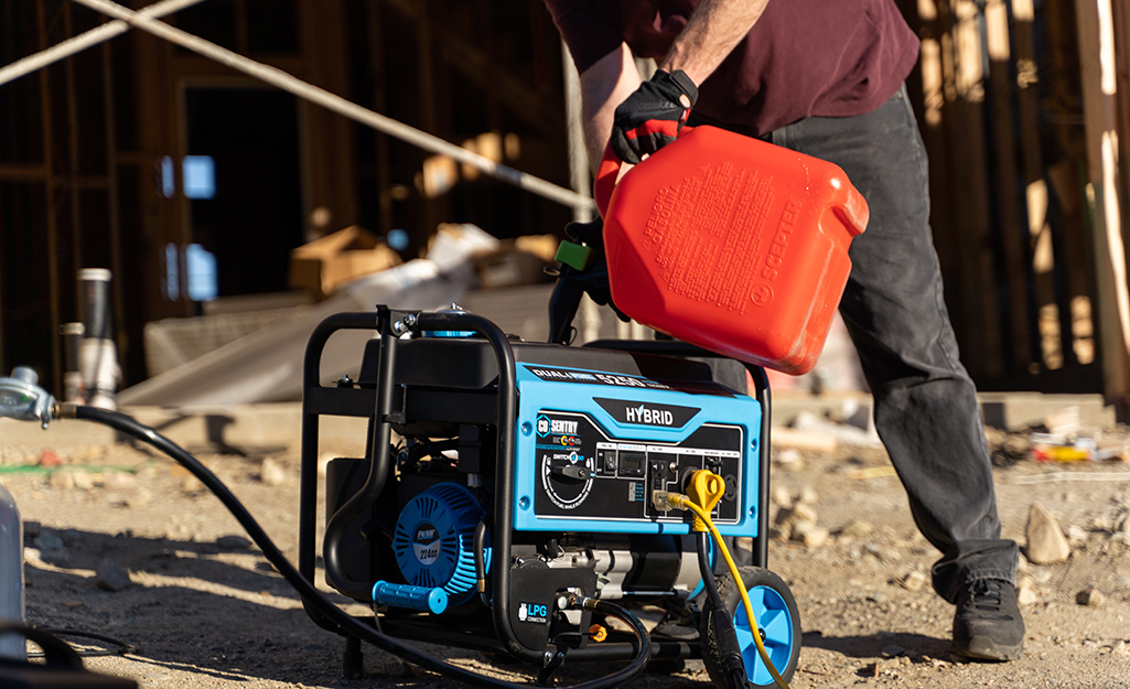 Someone refueling a generator. Someone refueling a generator.