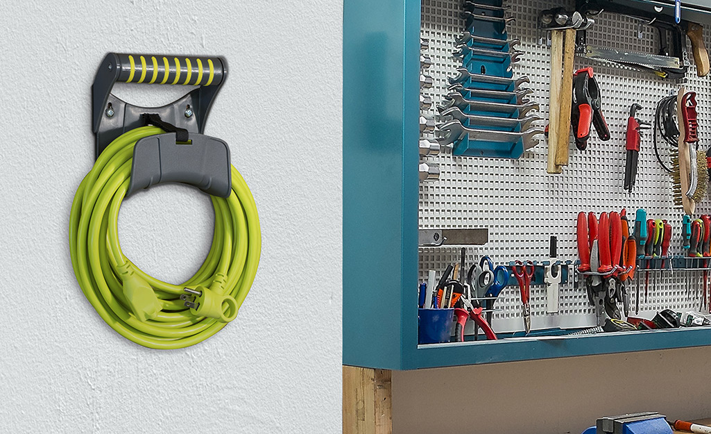 A utility extension cord hanging in a garage. A utility extension cord hanging in a garage.