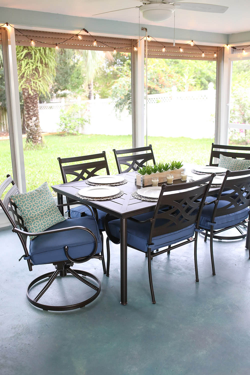 A patio dining table sits on a sealed and stained patio floor. A patio dining table sits on a sealed and stained patio floor.
